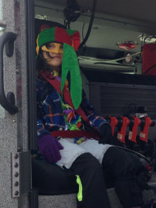 kid in a mask in a firetruck