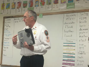 Fireman reading to kids