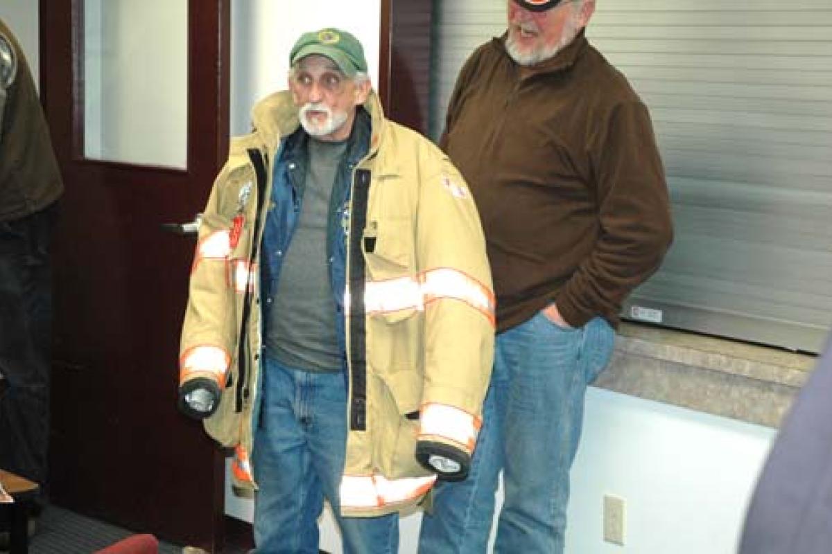 Man wearing firefighter jacket