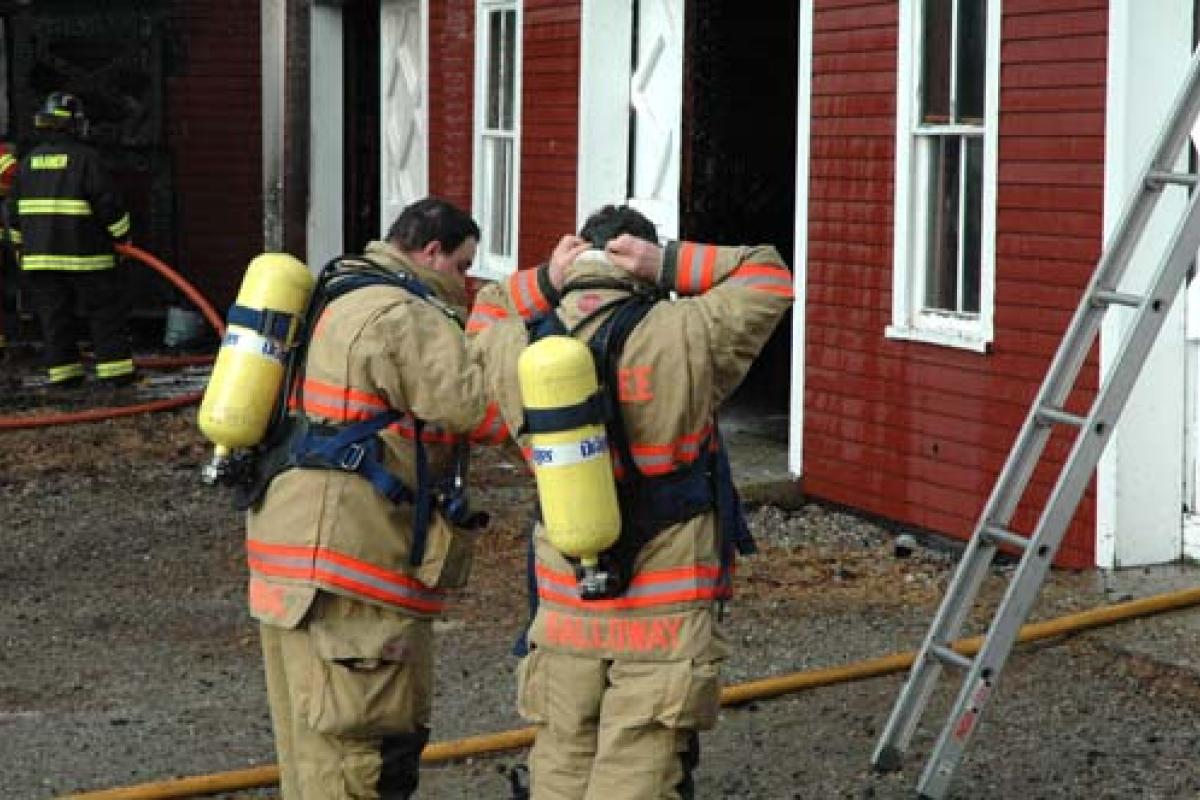 firemen gearing up for a fire