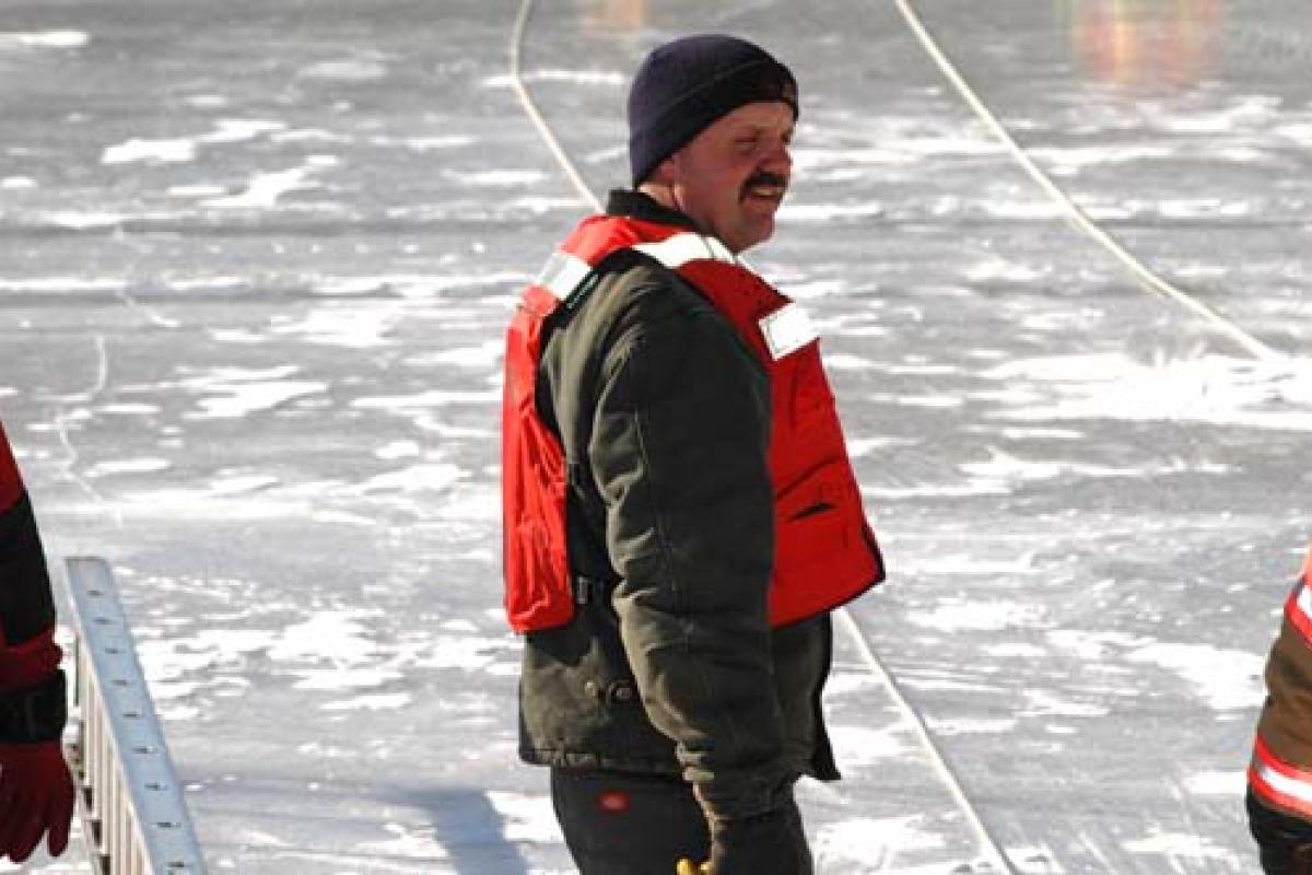 Fireman on frozen lake