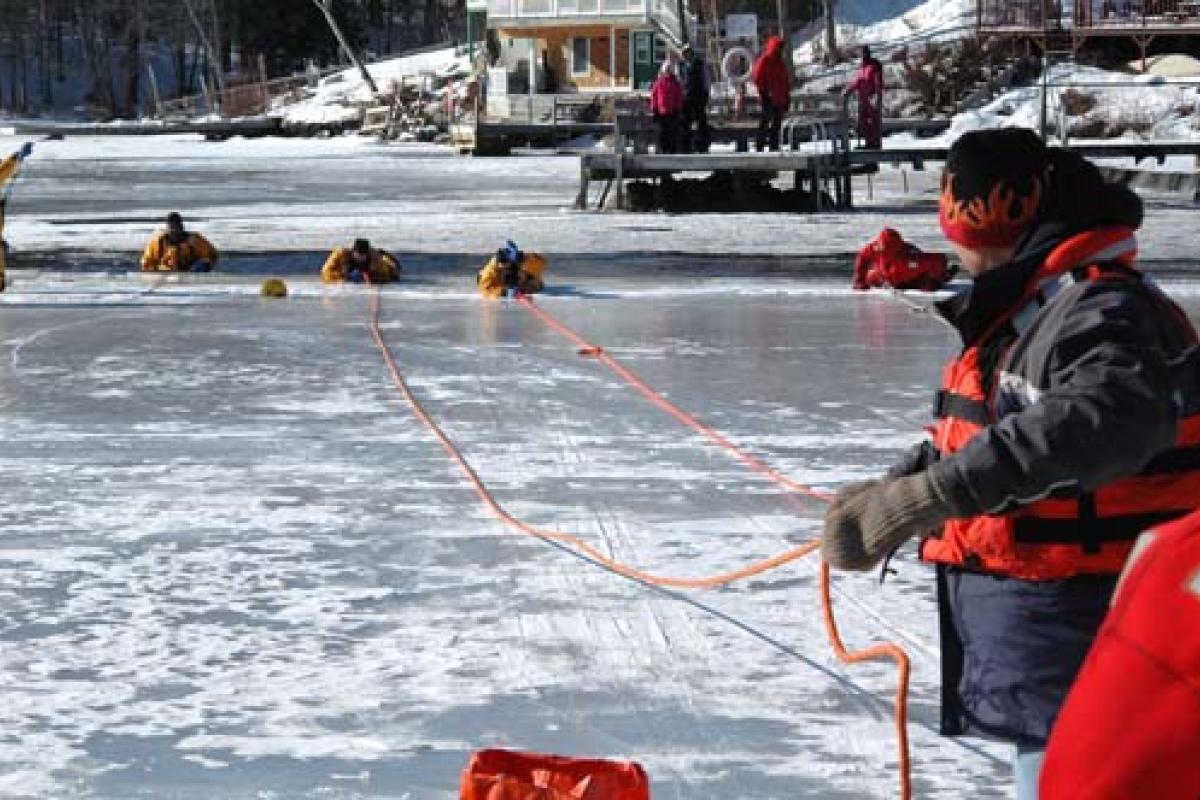 People being rescued from frozen lake