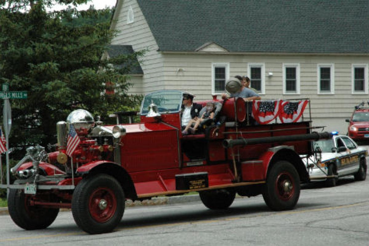 Man driving an old firetruck
