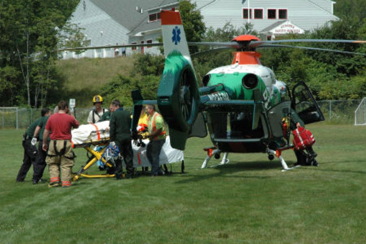 Person being loaded into rescue helicopter